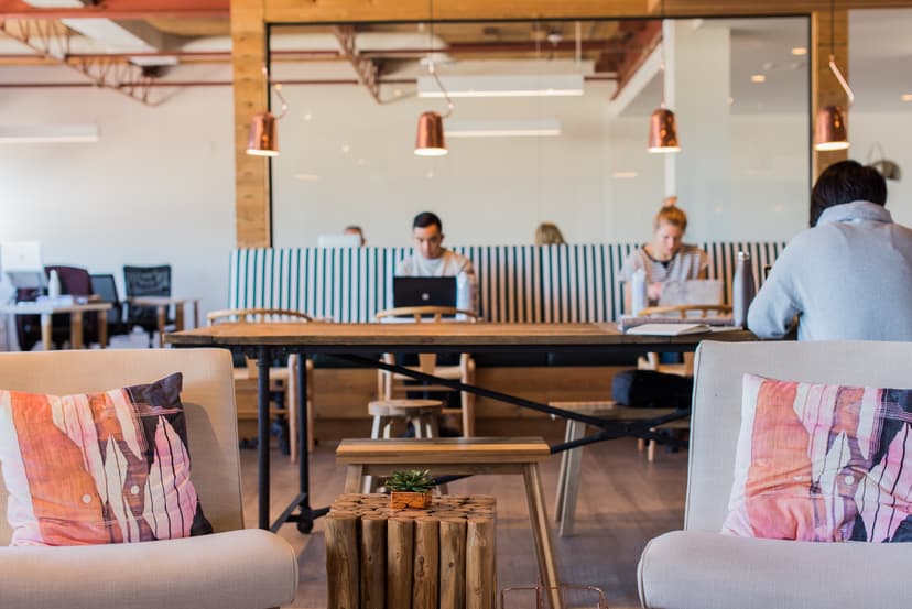 Open-plan office lounge with communal work table